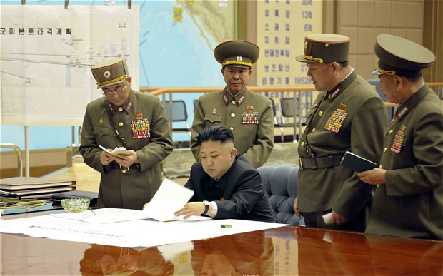 North Korean leader Kim Jong Un at a meeting with his generals where he ordered strategic rocket forces to be on standby to strike U.S. and South Korean targets, March 29, 2013. (Photo: KCNA via EPA)